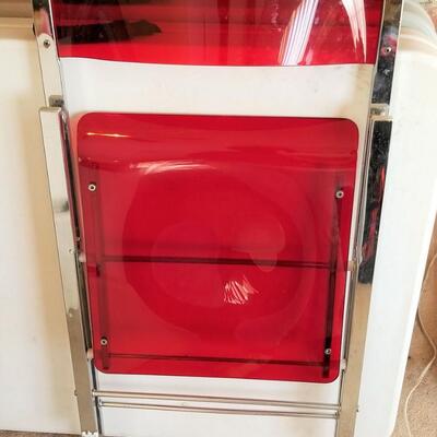 Lot #220  Folding Red Acrylic Chair
