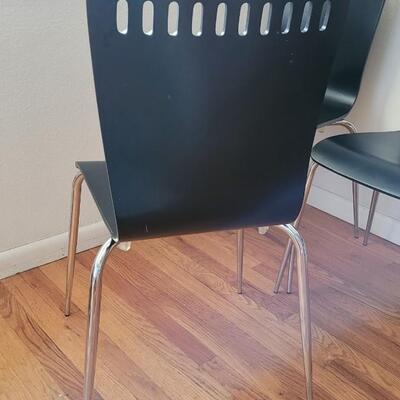Lot 199: (4) Mid Century Black Chairs