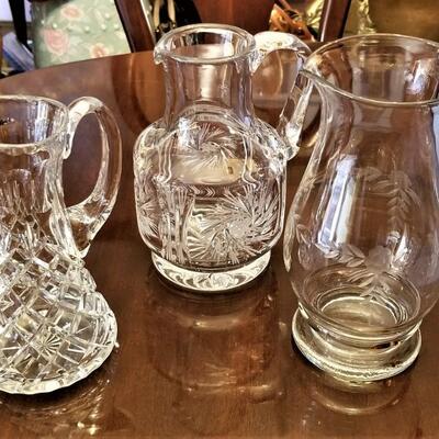 Lot #240  Lot of Three Crystal Pitchers