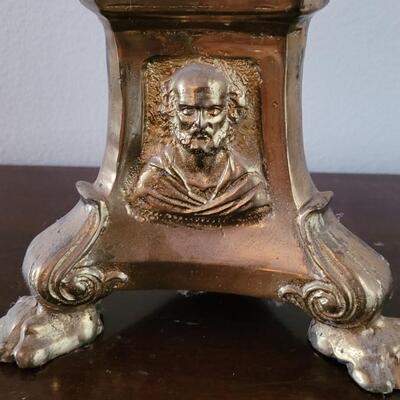 Lot 213: Antique Heavy Brass Alter Candleholder With An Angel and Mary, Jesus and Joseph on the base.