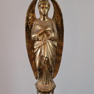 Lot 213: Antique Heavy Brass Alter Candleholder With An Angel and Mary, Jesus and Joseph on the base.