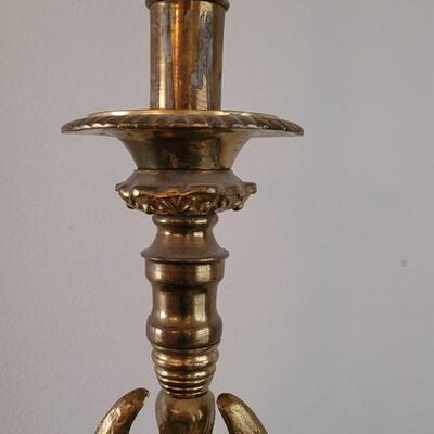 Lot 213: Antique Heavy Brass Alter Candleholder With An Angel and Mary, Jesus and Joseph on the base.