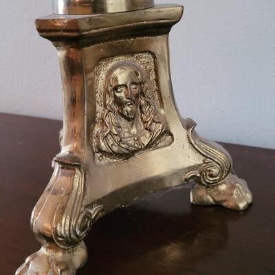 Lot 213: Antique Heavy Brass Alter Candleholder With An Angel and Mary, Jesus and Joseph on the base.