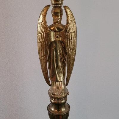 Lot 213: Antique Heavy Brass Alter Candleholder With An Angel and Mary, Jesus and Joseph on the base.