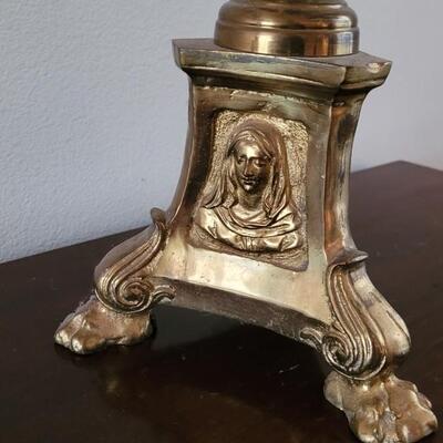 Lot 213: Antique Heavy Brass Alter Candleholder With An Angel and Mary, Jesus and Joseph on the base.