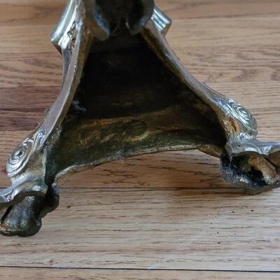 Lot 213: Antique Heavy Brass Alter Candleholder With An Angel and Mary, Jesus and Joseph on the base.