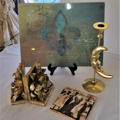 Lot #259 Decor Lot - Glass cutting Board, Bookends, Tile, and Candlestick