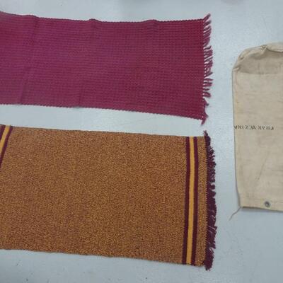 LOT 334. TWO THROW RUGS AND CANVAS BAG