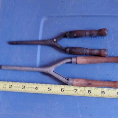 LOT 153  TWO OLD WOOD HANDLED CURLING IRONS
