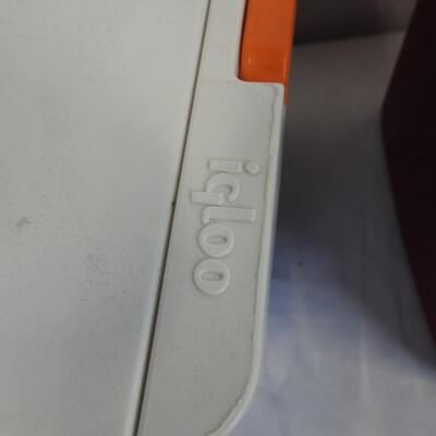 2 Small Coolers: 1 Blue Igloo Cooler with Orange Handle, Red Coleman Cooler