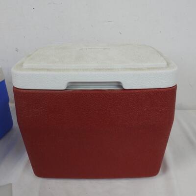 2 Small Coolers: 1 Blue Igloo Cooler with Orange Handle, Red Coleman Cooler