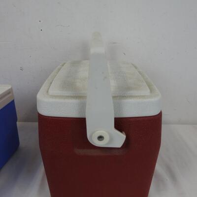 2 Small Coolers: 1 Blue Igloo Cooler with Orange Handle, Red Coleman Cooler
