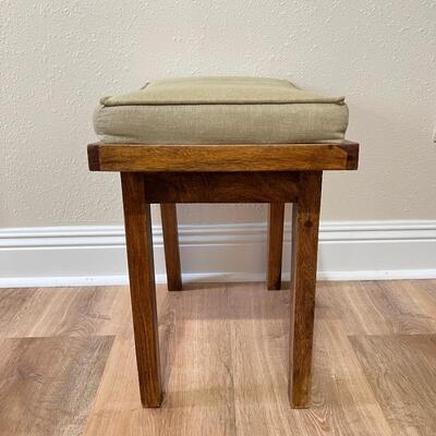 Small Wooden Stool With Light Tan Cushion Top