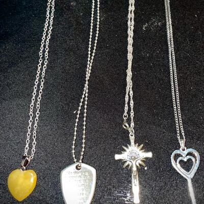 Four pendants with included chains