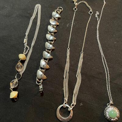 Three necklaces and bracelet lot. Minimal signs of use. Metal and stones untested
