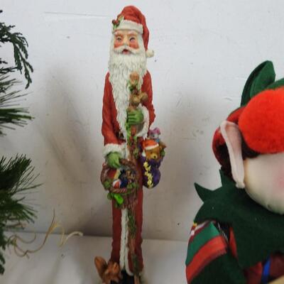 Christmas Decorated Sleds, Santa Figurines, Candles, Baskets with Faux Flowers