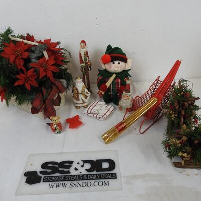 Christmas Decorated Sleds, Santa Figurines, Candles, Baskets with Faux Flowers