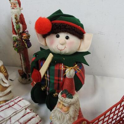 Christmas Decorated Sleds, Santa Figurines, Candles, Baskets with Faux Flowers