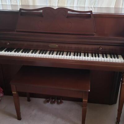 Wurlitzer piano with bench