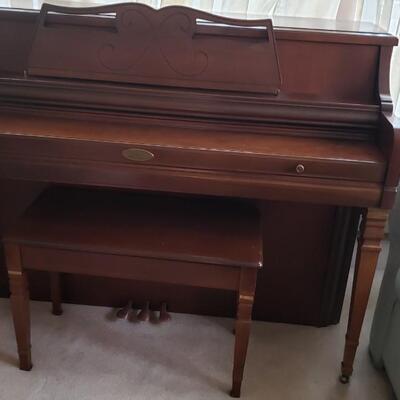 Wurlitzer piano with bench