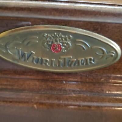 Wurlitzer piano with bench