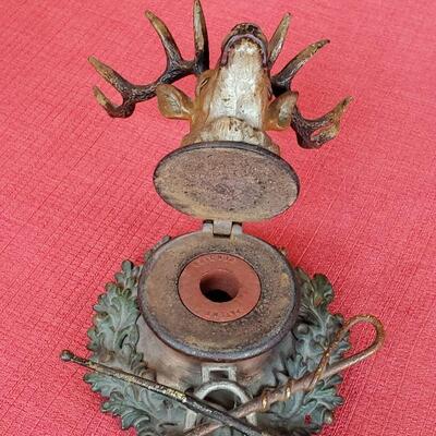 Old bronze inkwell with fountain pen rest