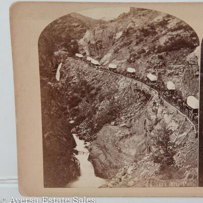COLORADO STEREOVIEW - COVERED WAGONS DESCENDING PIKES PEAK