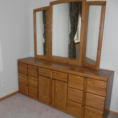 LOT 50  SEVEN DRAWER DRESSER WITH HINGED MIRRORS