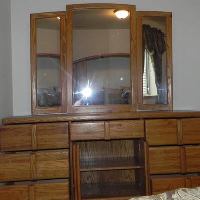 LOT 50  SEVEN DRAWER DRESSER WITH HINGED MIRRORS