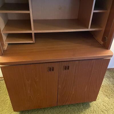 LOT 810. VINTAGE DANISH MODERN TEAK ROLLTOP PULL OUT DESK CABINET