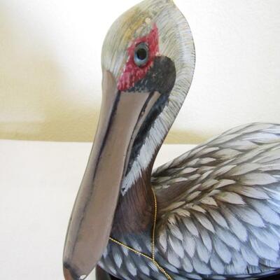 LOT 6  BROWN WOODEN PELICAN BY JOHN MADISON