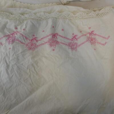 Seven Assorted White Pillow Cases with Floral Designs. Hand Embroidered