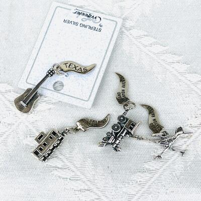 GROUP OF 4 STATE & SCENIC ATTRACTIONS STERLING SILVER CHARMS