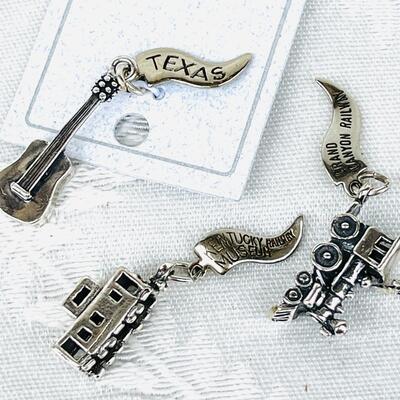 GROUP OF 4 STATE & SCENIC ATTRACTIONS STERLING SILVER CHARMS