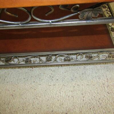 LOT 35  TWO TIER ORNATE IRON COFFEE TABLE WITH GLASS TOP