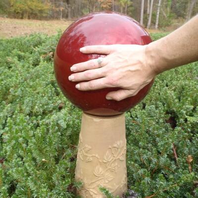 Red Gazing ball on stand