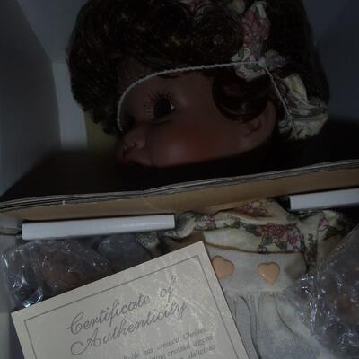 New in box; "Chelsea" Porcelain Doll