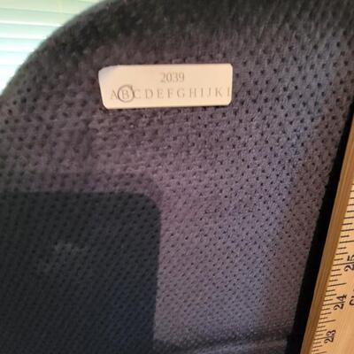 blue rolling desk chair with side arms