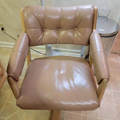 glass octagon table with 4 rolling camel colored chairs