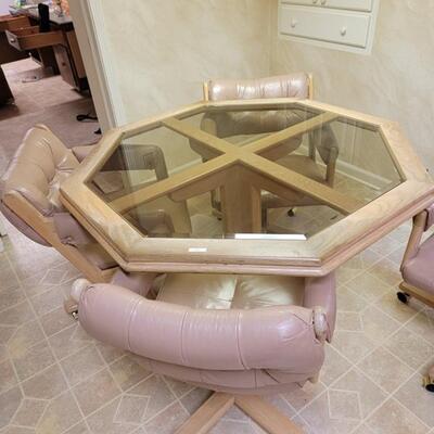 glass octagon table with 4 rolling camel colored chairs