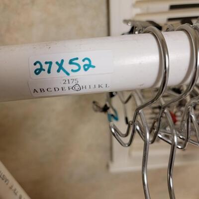 clothing rack, hangers, hat dishwater safe basket and misc laundry supplies