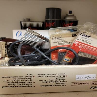 oster hair clipper lot with lots of attachments