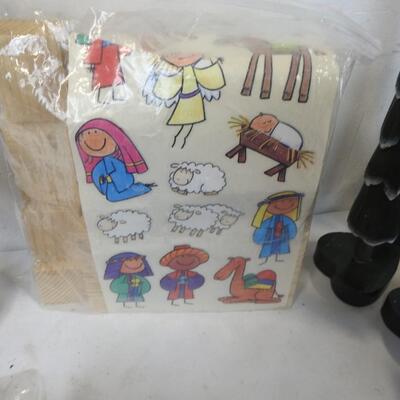Christmas lot: 3 tree skirts, trees, nativity kit, tins, garland, door hanger