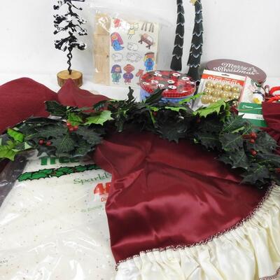 Christmas lot: 3 tree skirts, trees, nativity kit, tins, garland, door hanger