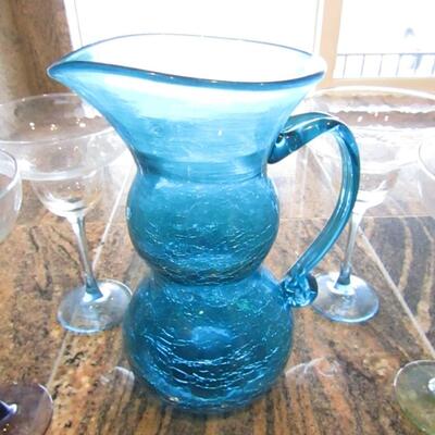 LOT 73  BLUE GLASS PITCHER AND 4 MARGARITA GLASSES