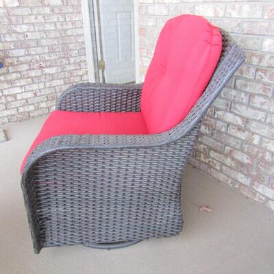 LOT 89  OUTDOOR WICKER SWIVEL GLIDER CHAIR WITH CUSHIONS