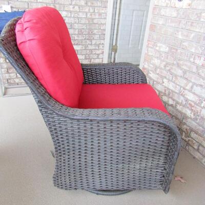 LOT 90  OUTDOOR WICKER SWIVEL AND GLIDER CHAIR WITH CUSHIONS