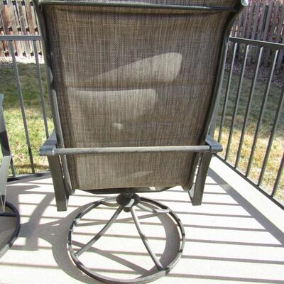 LOT 99  FOUR SWIVEL PATIO CHAIRS