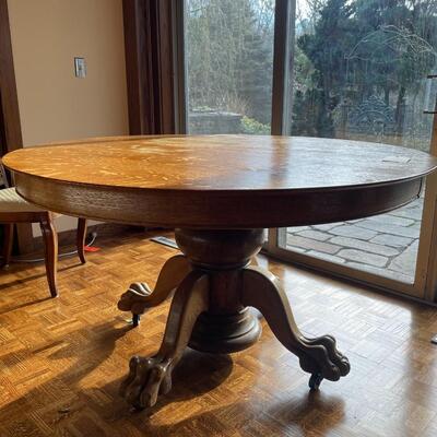 Beautiful round claw foot oak pedestal table