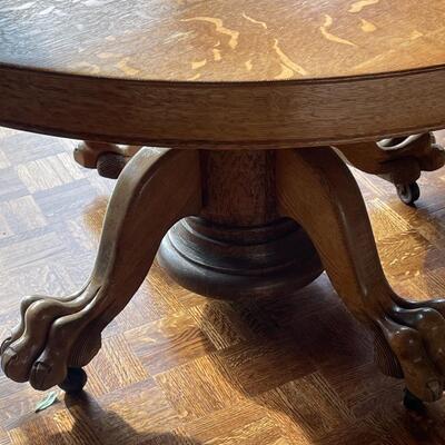 Beautiful round claw foot oak pedestal table